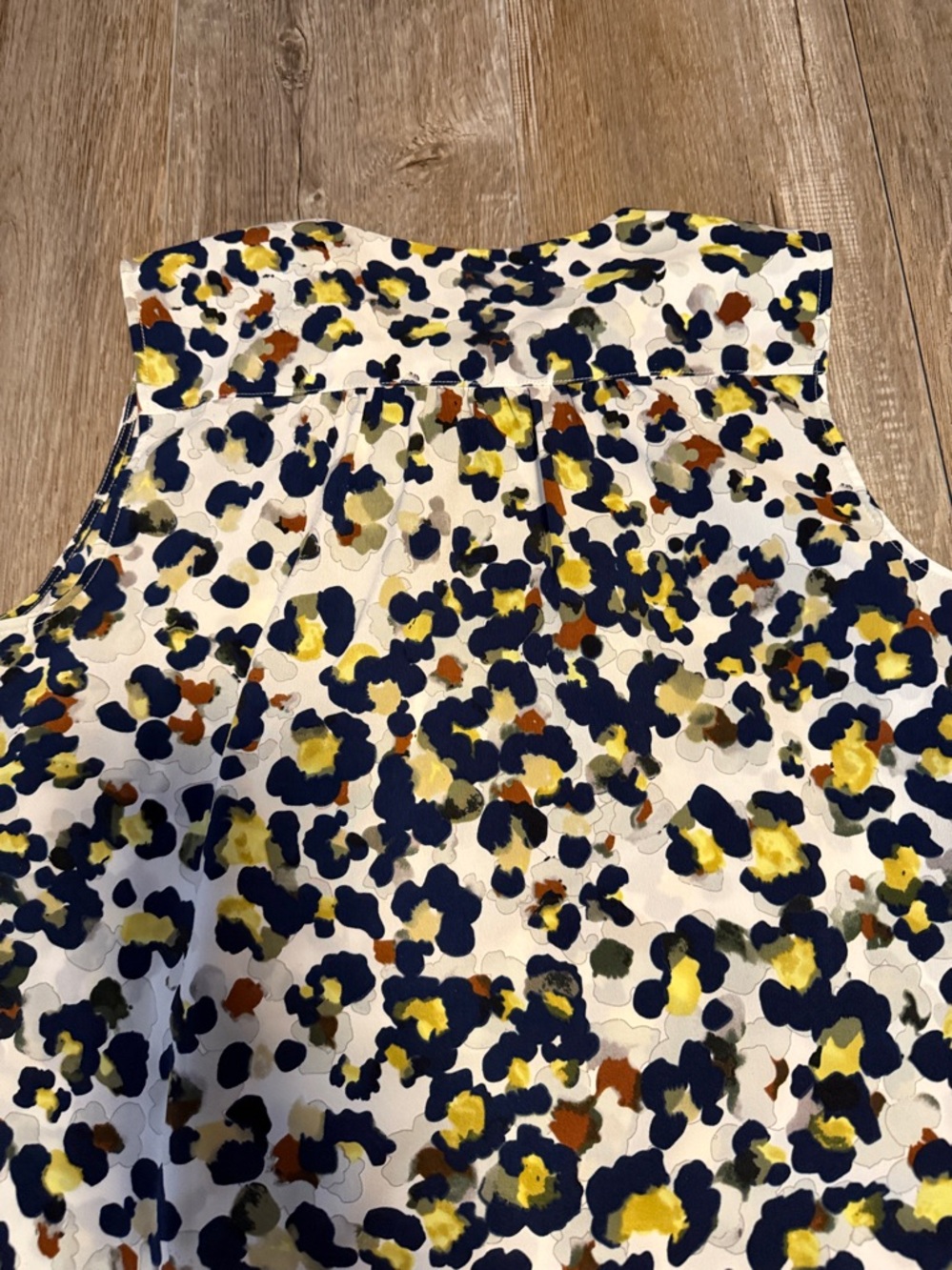 CAbi Fierce Seeing Spots sleeveless blouse featuring a colorful animal print - Picture 6 of 6